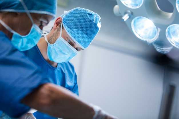 Surgeons working in operation room