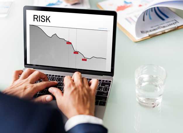 Laptop being used to display lowering risk statistic on line chart.