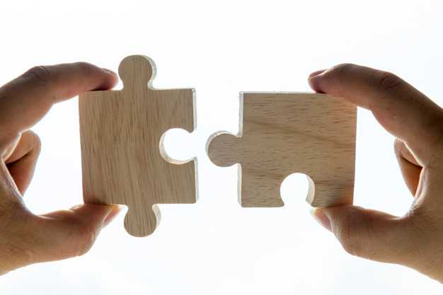 Two pieces of a jigsaw being connected together