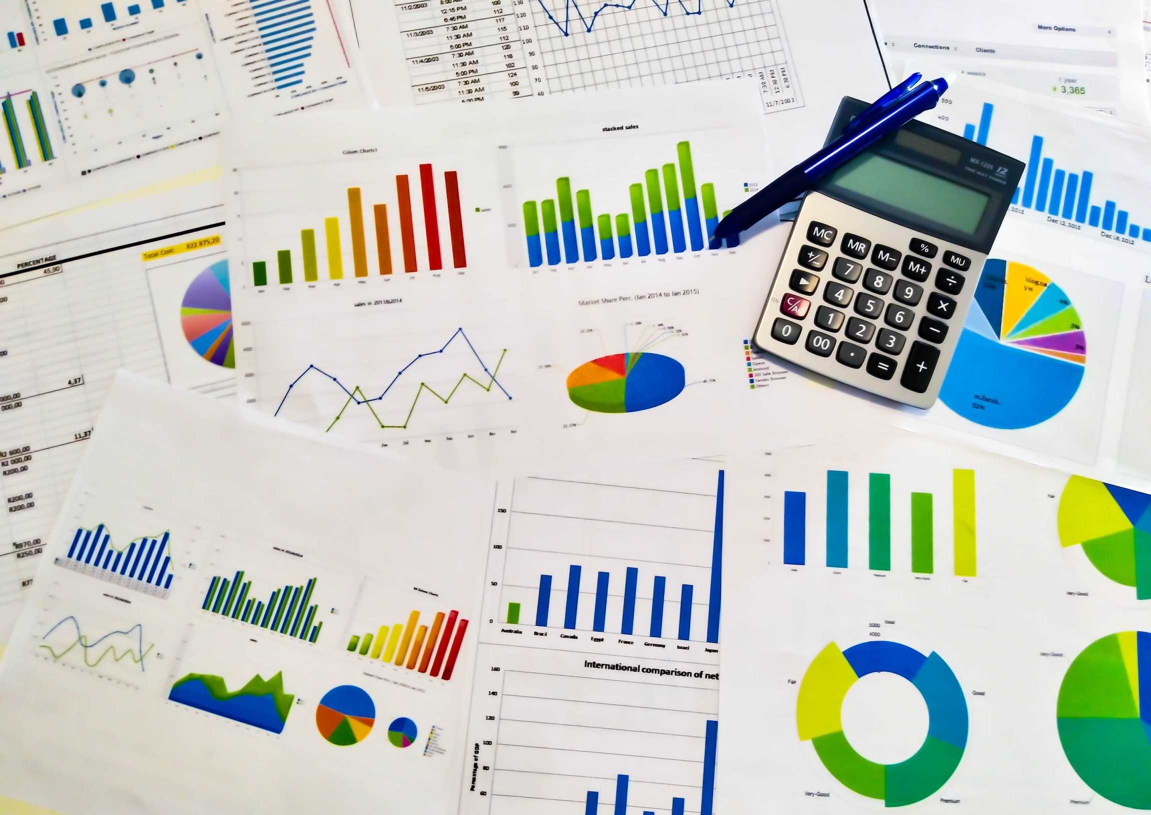Papers of statistical charts spread on a table